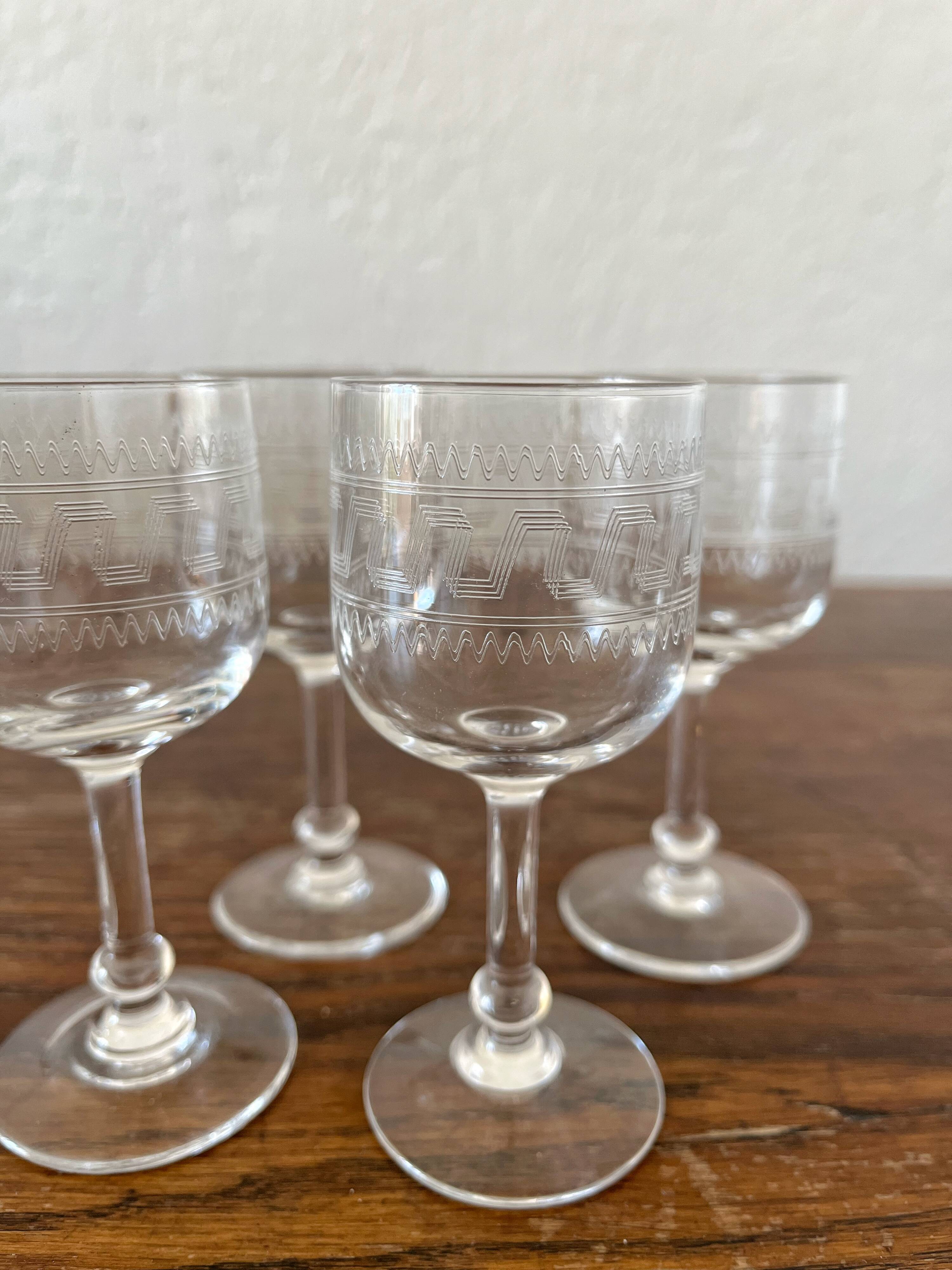 Four antique stemmed liqueur glasses in engraved crystal, 19th century