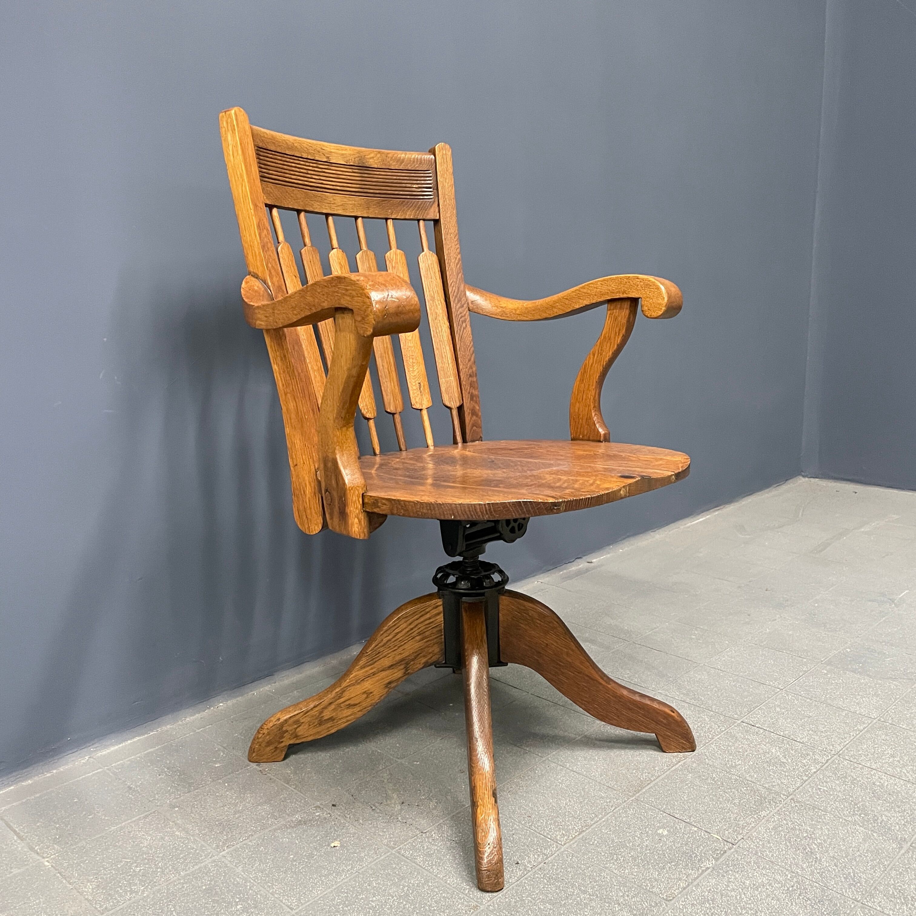 Antique American oak office chair with armrests 1920s