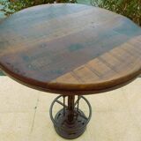 Unique bistro table with its adjustable industrial cast iron leg