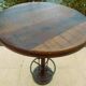 Unique bistro table with its adjustable industrial cast iron leg