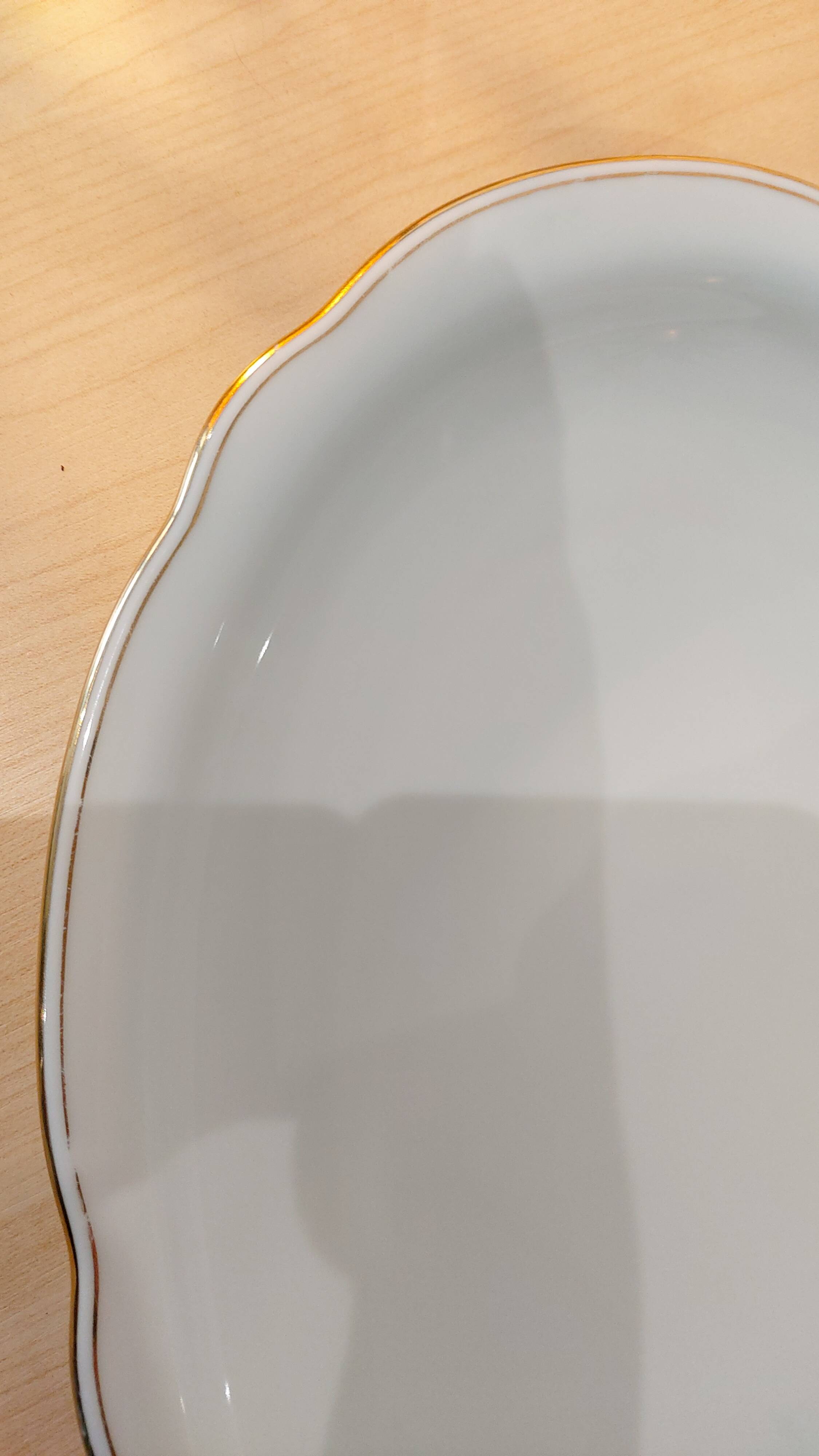 Oval porcelain plate white with gold edging