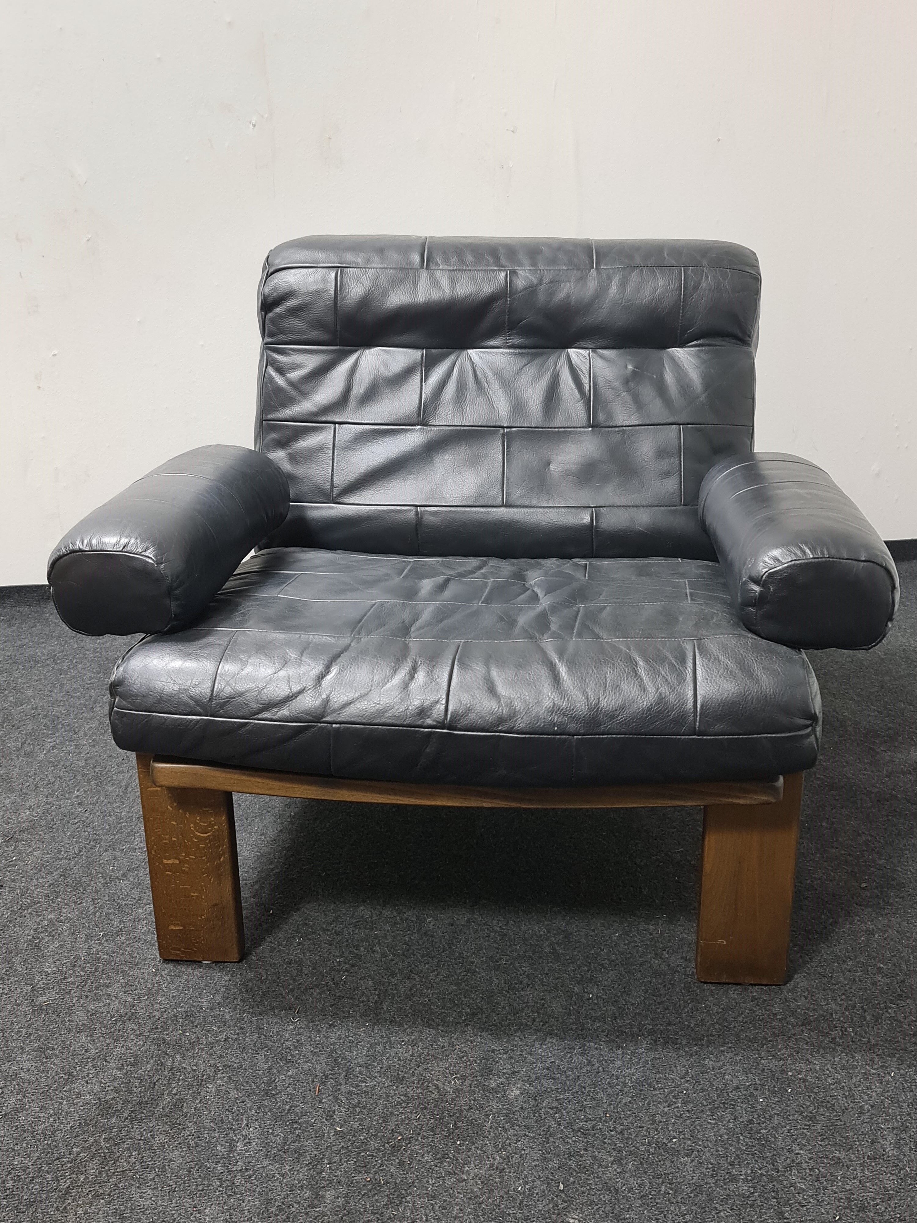 Vintage black leather patchwork and oak lounge chair