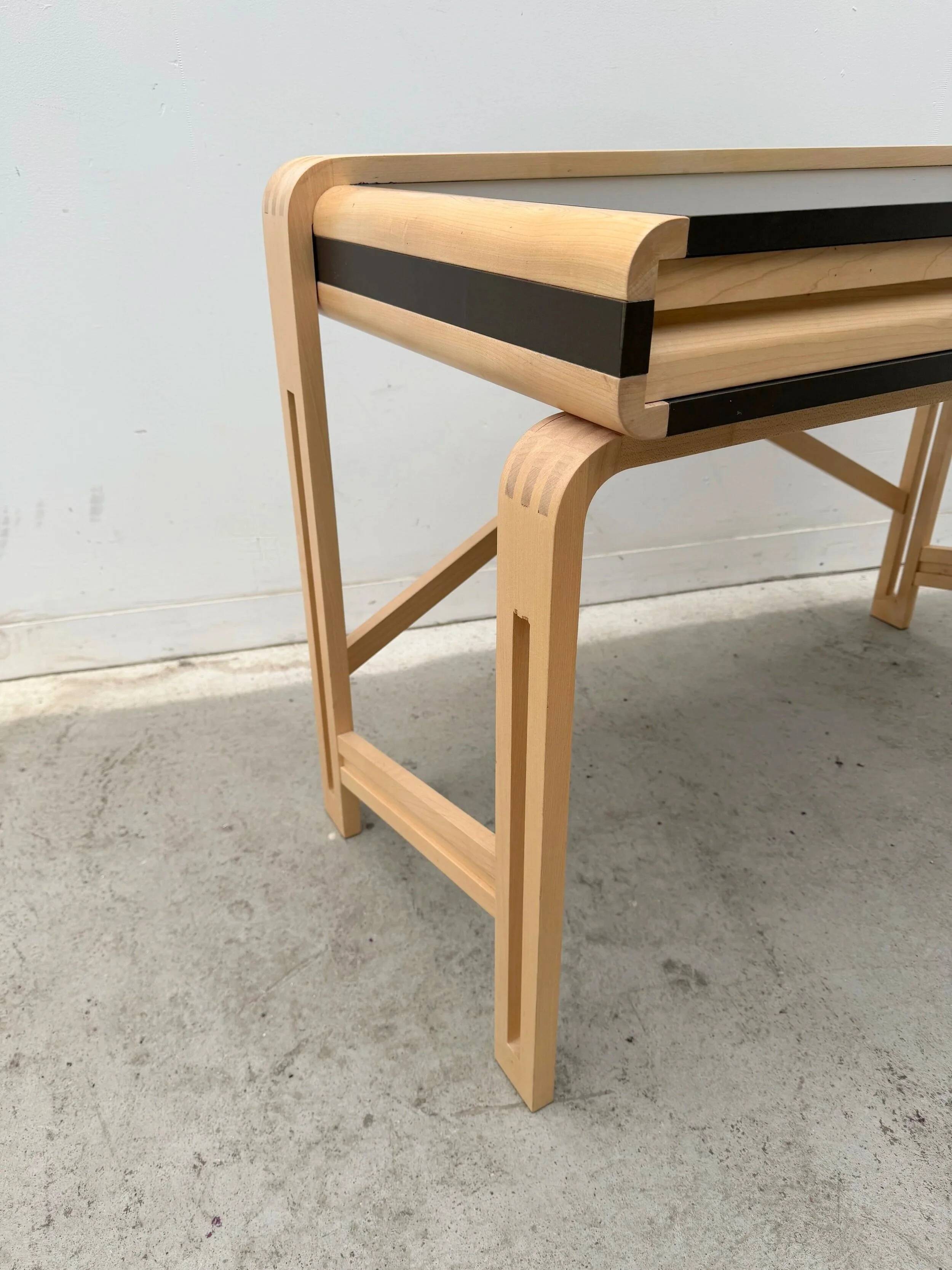 Solid wood and formica desk made by a cabinetmaker.