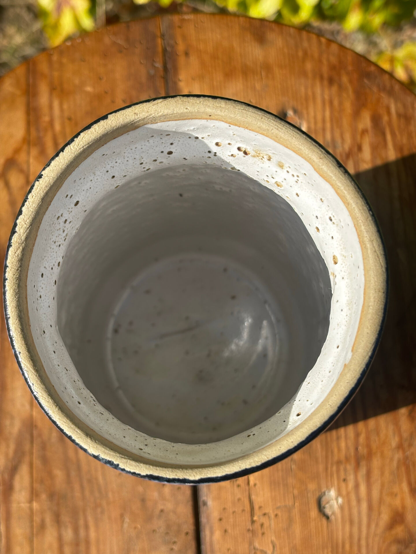 Pretty pot or vase in glazed stoneware with blue drip effect.