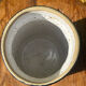 Pretty pot or vase in glazed stoneware with blue drip effect.