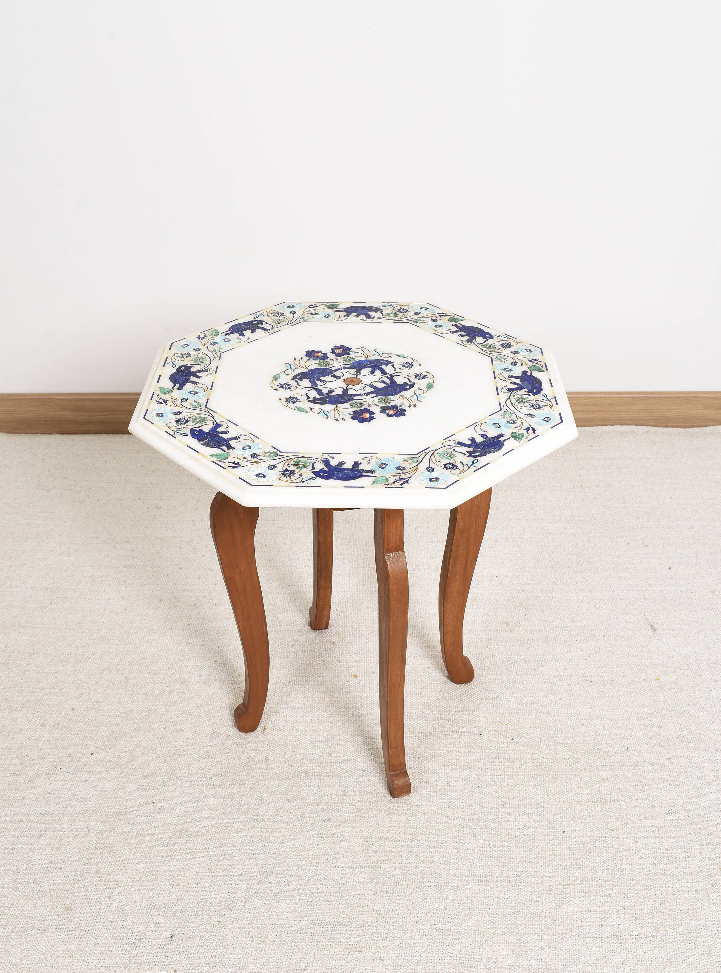 Side table with marble top and inlaid stones