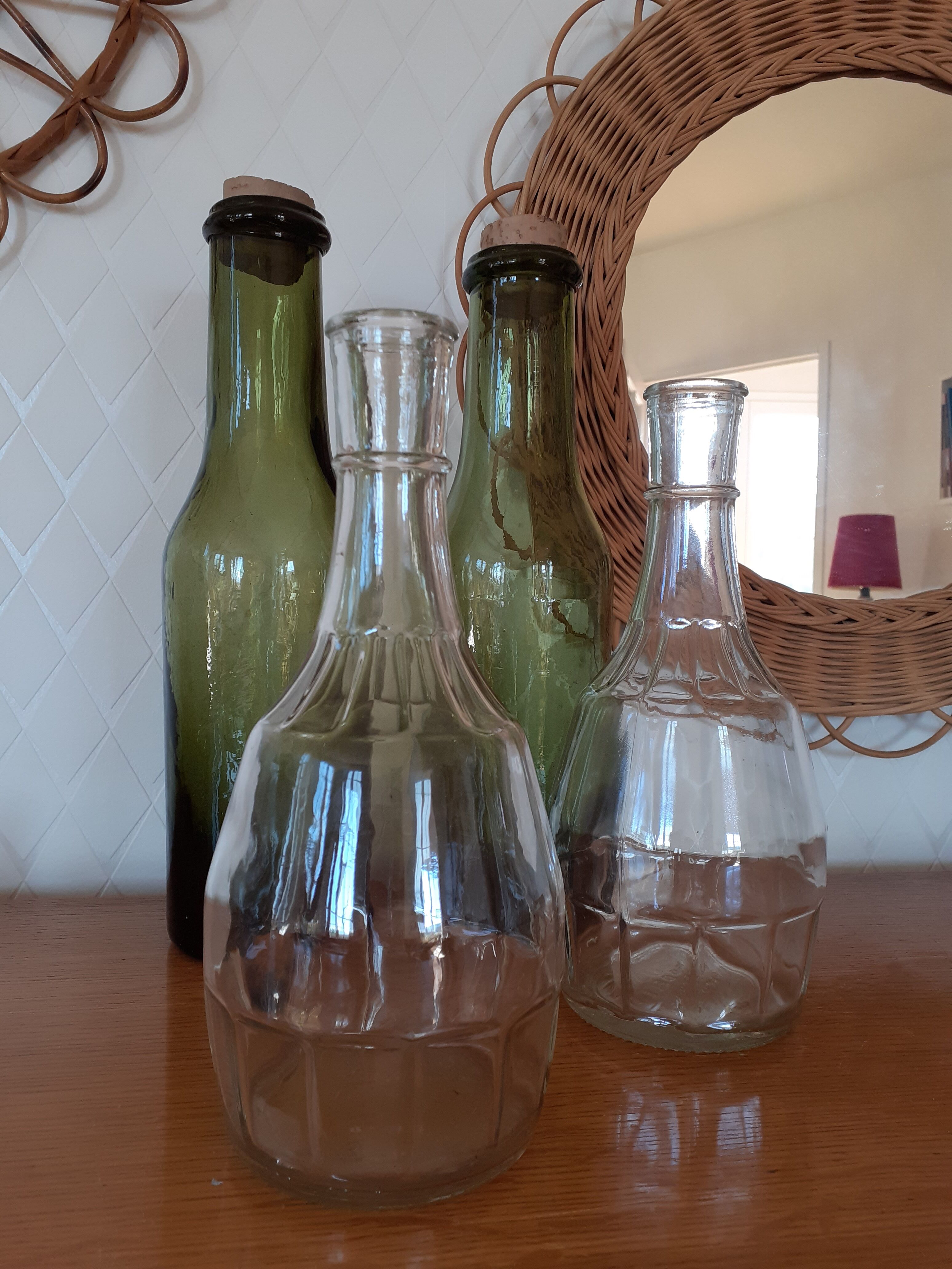 Pair of green bottles made of bubbled blown glass