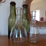 Pair of green bottles made of bubbled blown glass