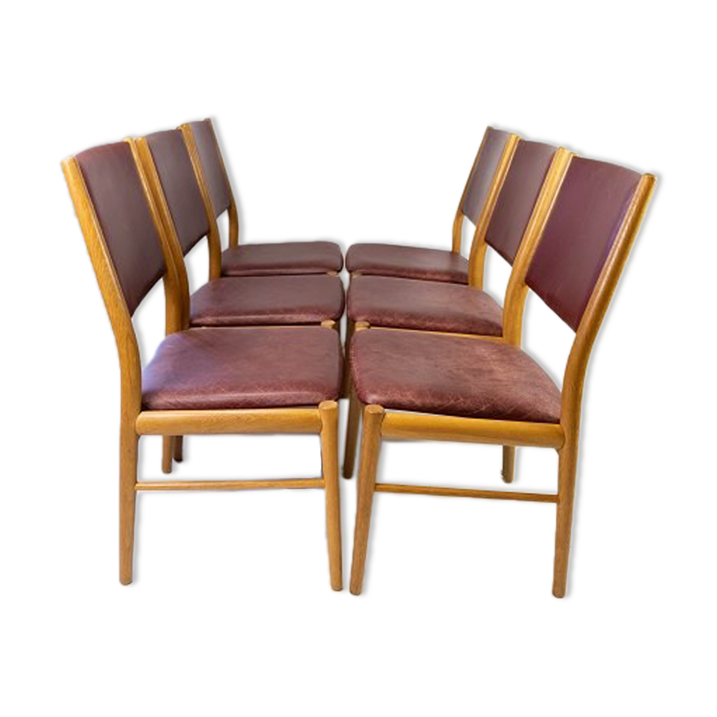 Suite of six chairs in oak and leather