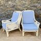 Pair of white rattan armchairs