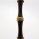 Tripod floor lamp in wrought iron and brass with bamboo-style base.