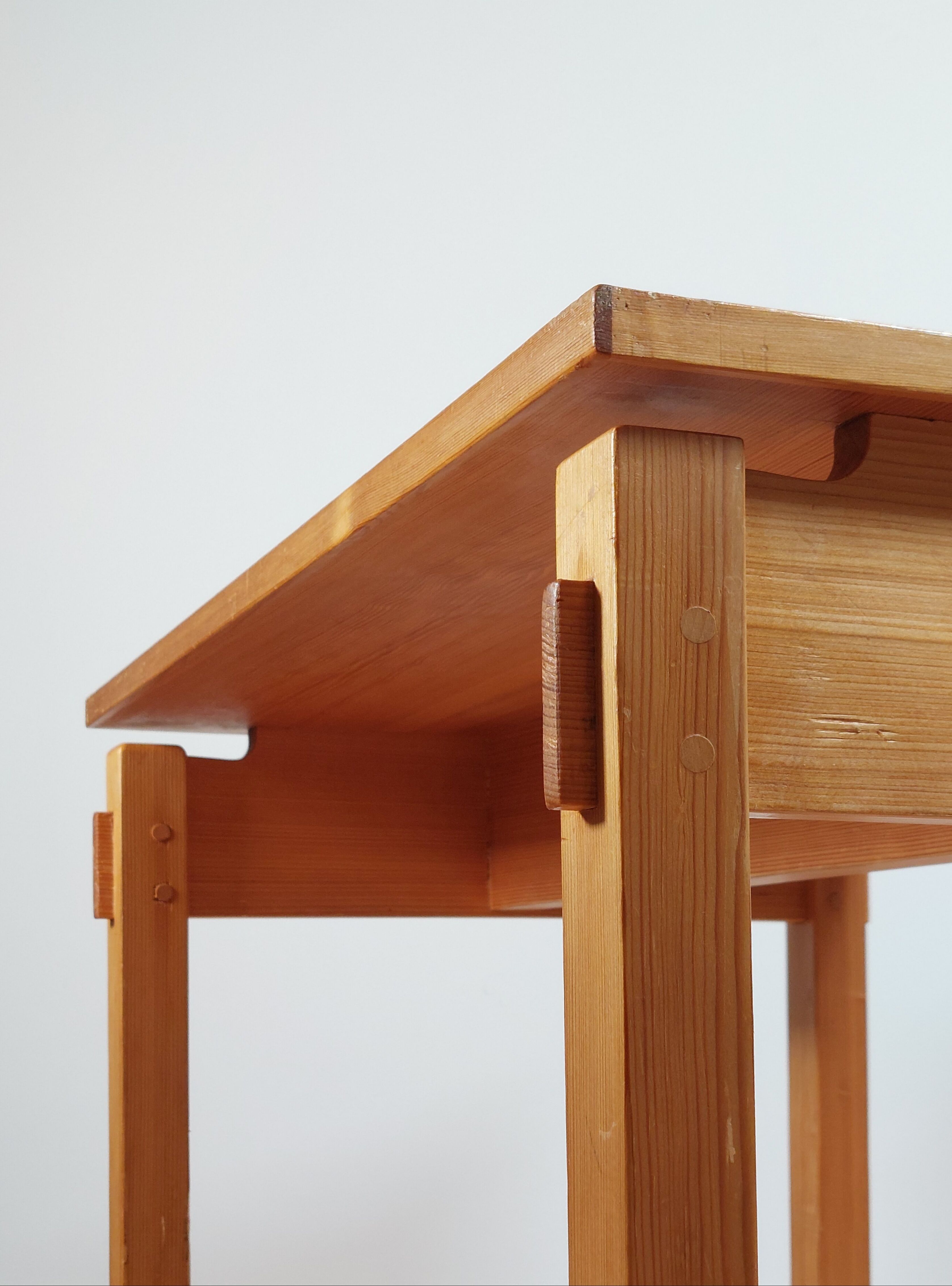 Meticulously crafted vintage pine side table, a masterpiece.