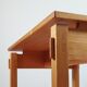 Meticulously crafted vintage pine side table, a masterpiece.