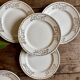 Set of 8 vintage white and gold dessert plates.