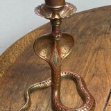 Chiseled brass cobra candlestick