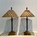 Pair of lamps in patinated gold metal