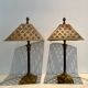 Pair of lamps in patinated gold metal
