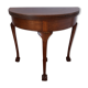 A half-moon english mahogany games table