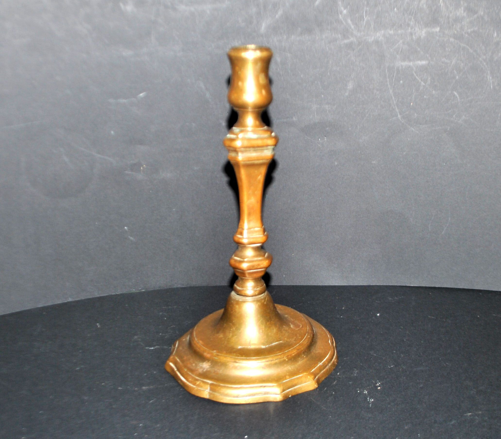 Antique candle holder, carved in bronze, 18th century.