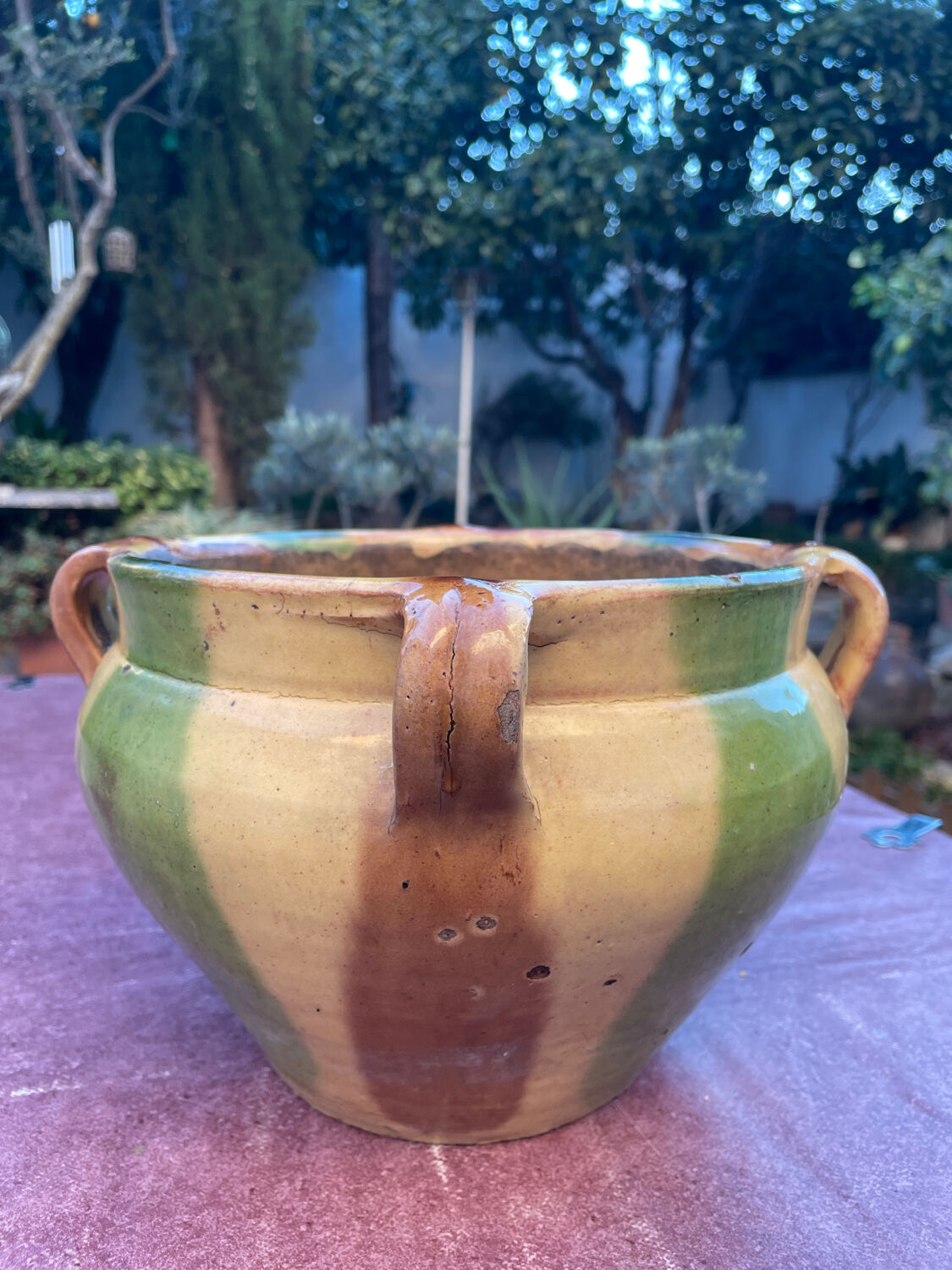 Old terracotta flower pot varnished