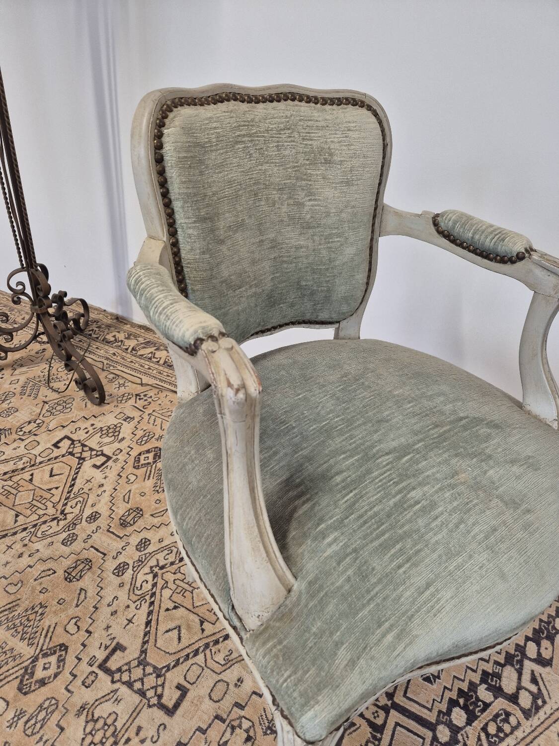 Louis XV style cabriolet armchair in patinated wood and velvet