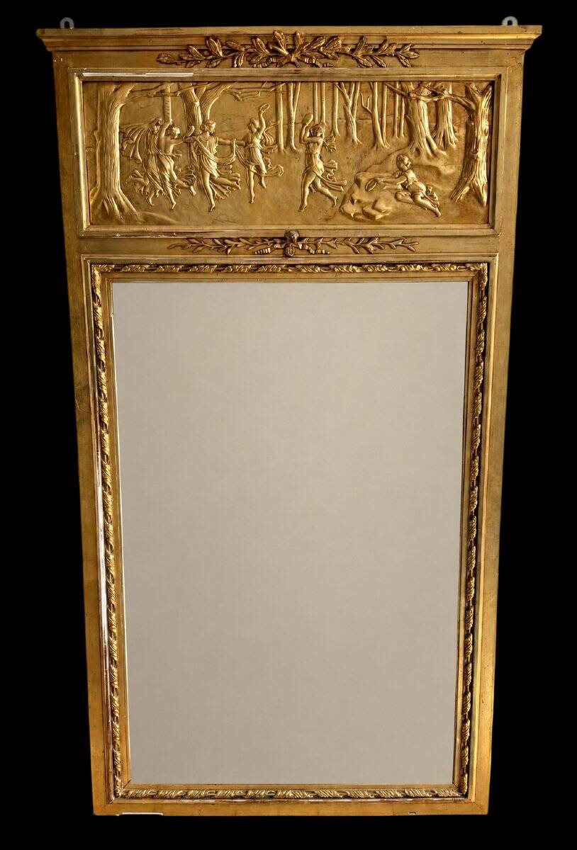 Gilded trumeau in the Louis XVI style with curious decorations.