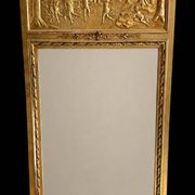 Gilded trumeau in the Louis XVI style with curious decorations.