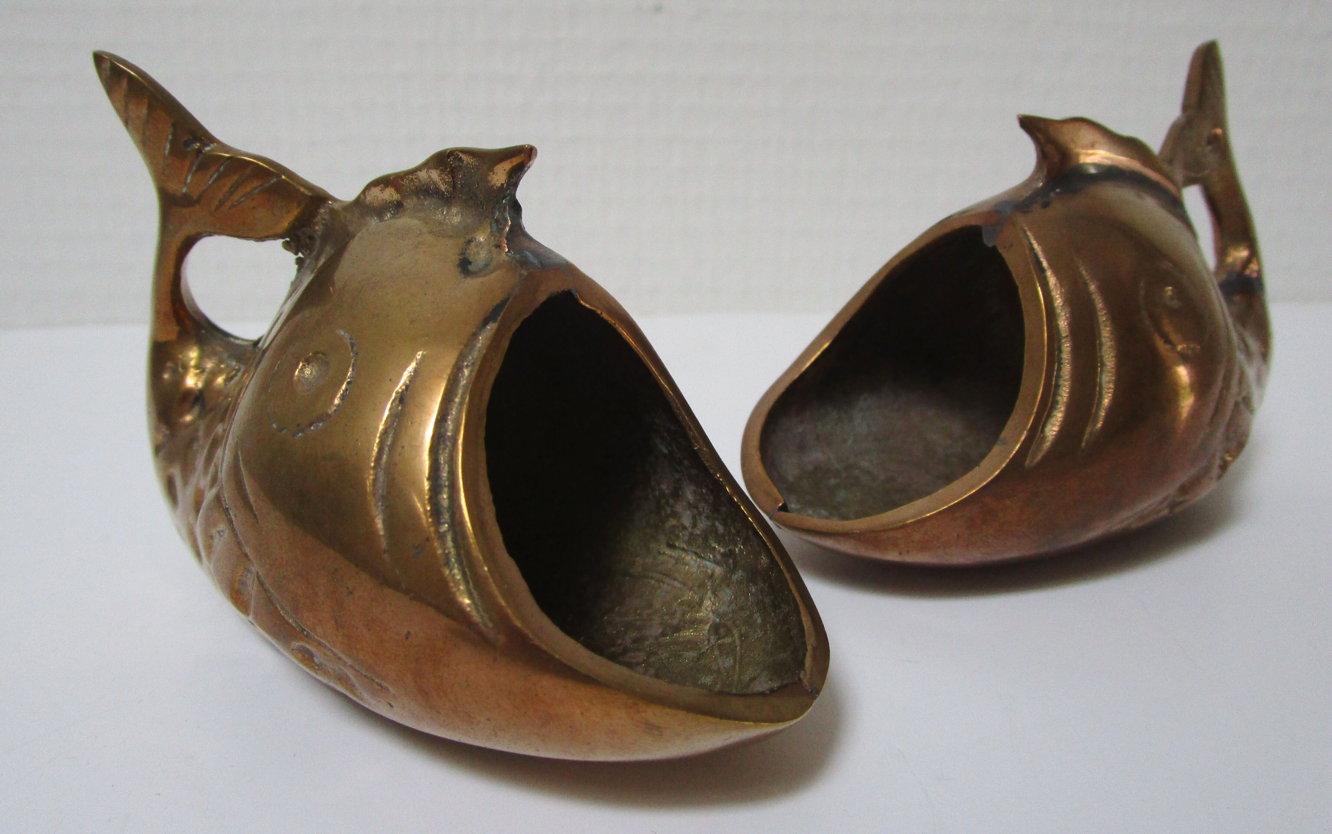 Two vintage brass fish ashtrays