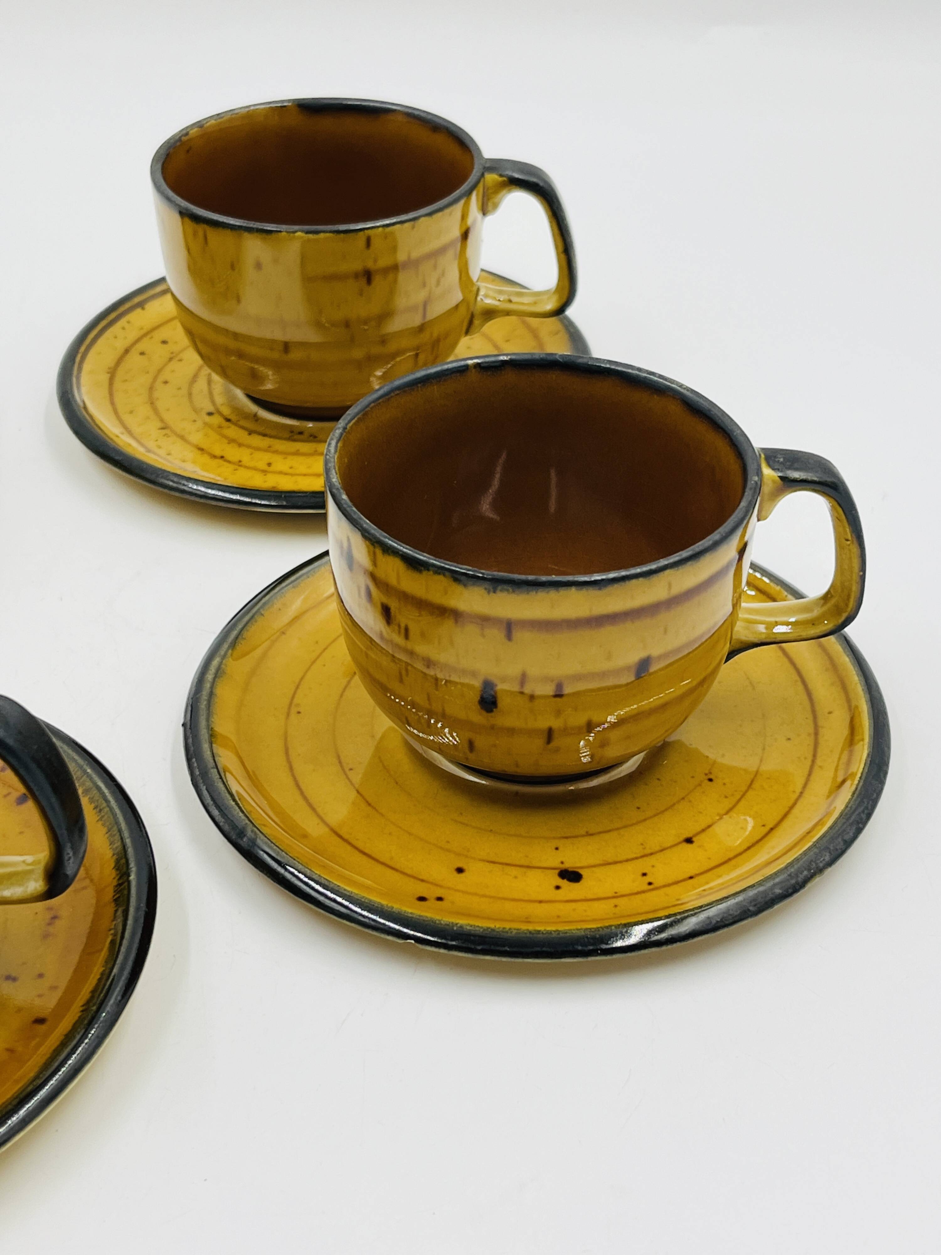 Set of four vintage Boch Palma cups and saucers.