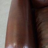 Fauteuil anglais ancien en cuir de mouton