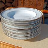 Twelve white porcelain plates