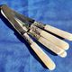 4 antique butter spreading knives in silver-plated metal and mother-of-pearl.