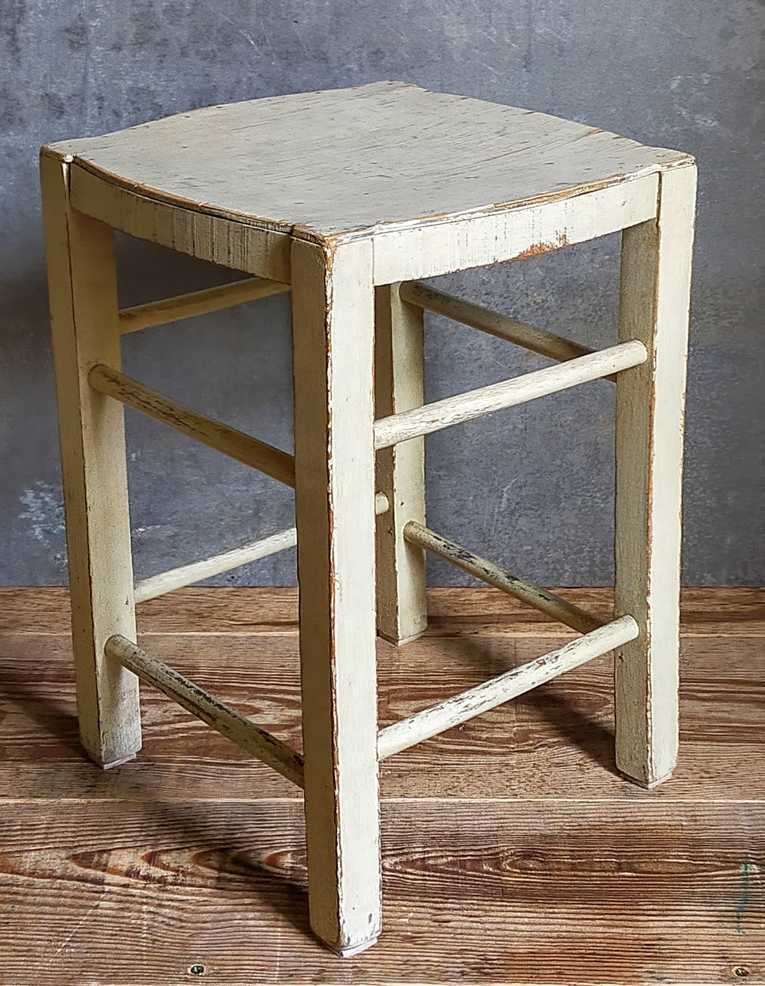 Old patinated painted wooden stool