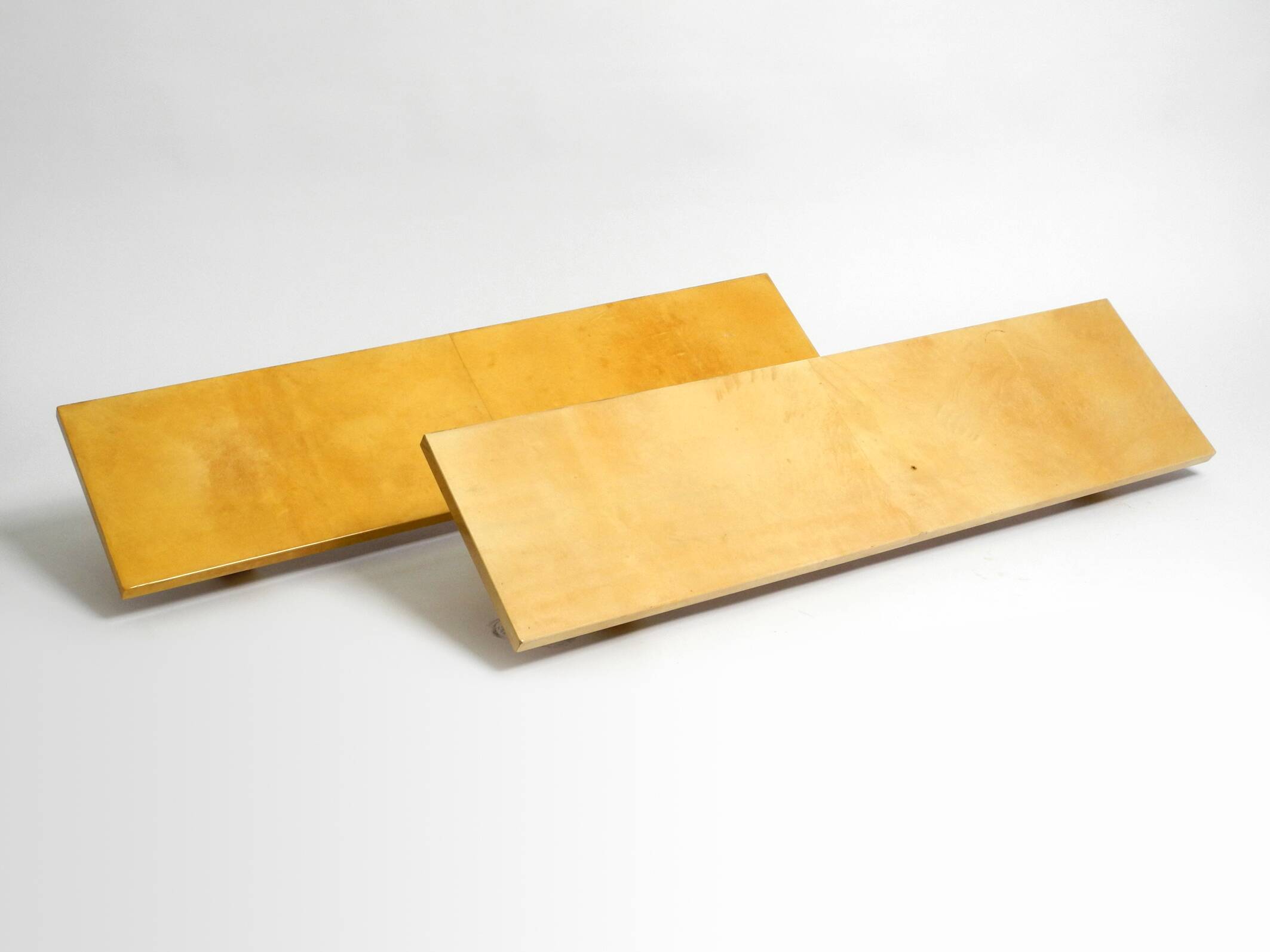 Two 1960s large Aldo Tura shelves made of wood and goatskin in beige