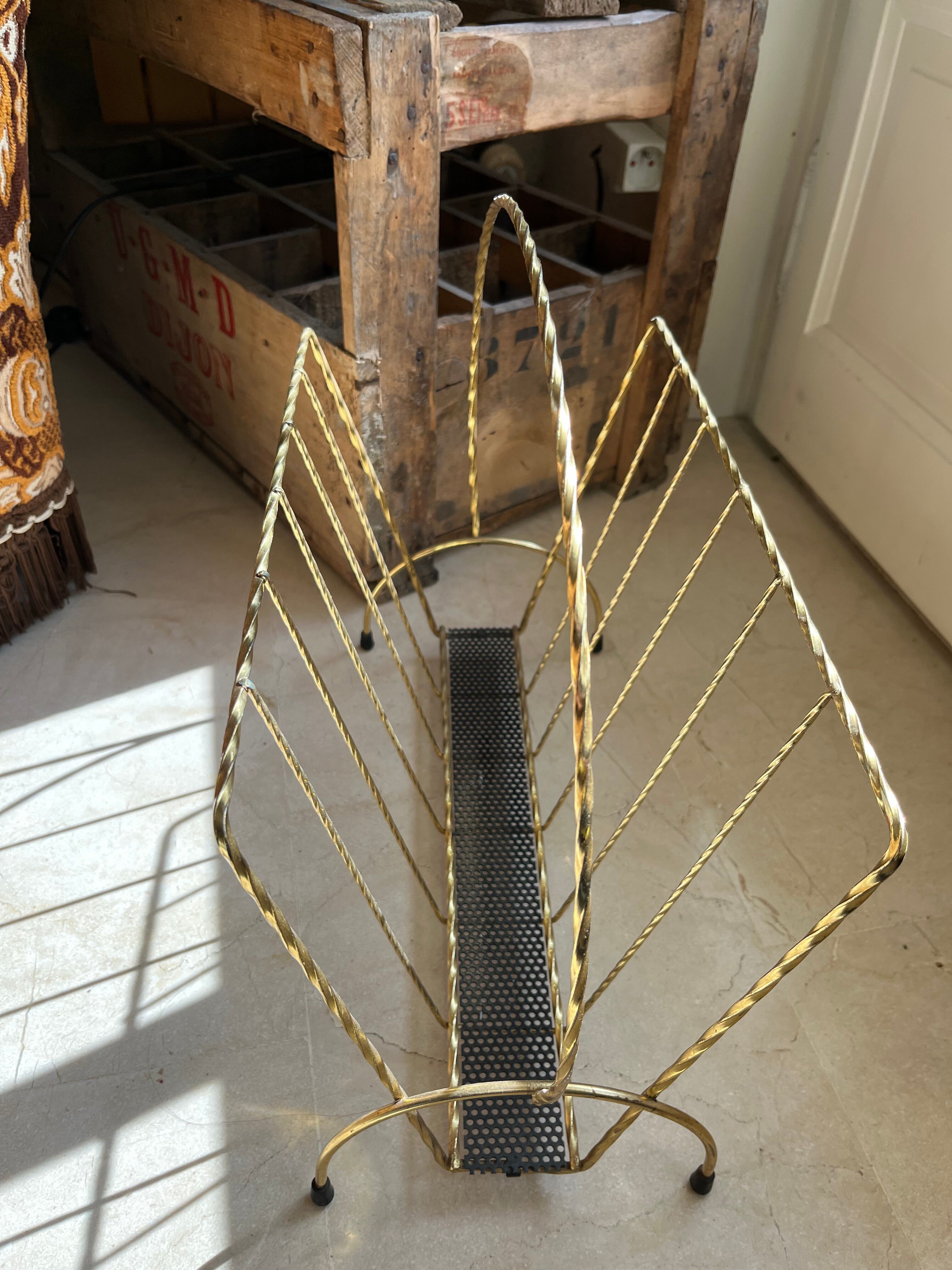 Vintage gold metal magazine rack from the 1960s.