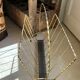Vintage gold metal magazine rack from the 1960s.