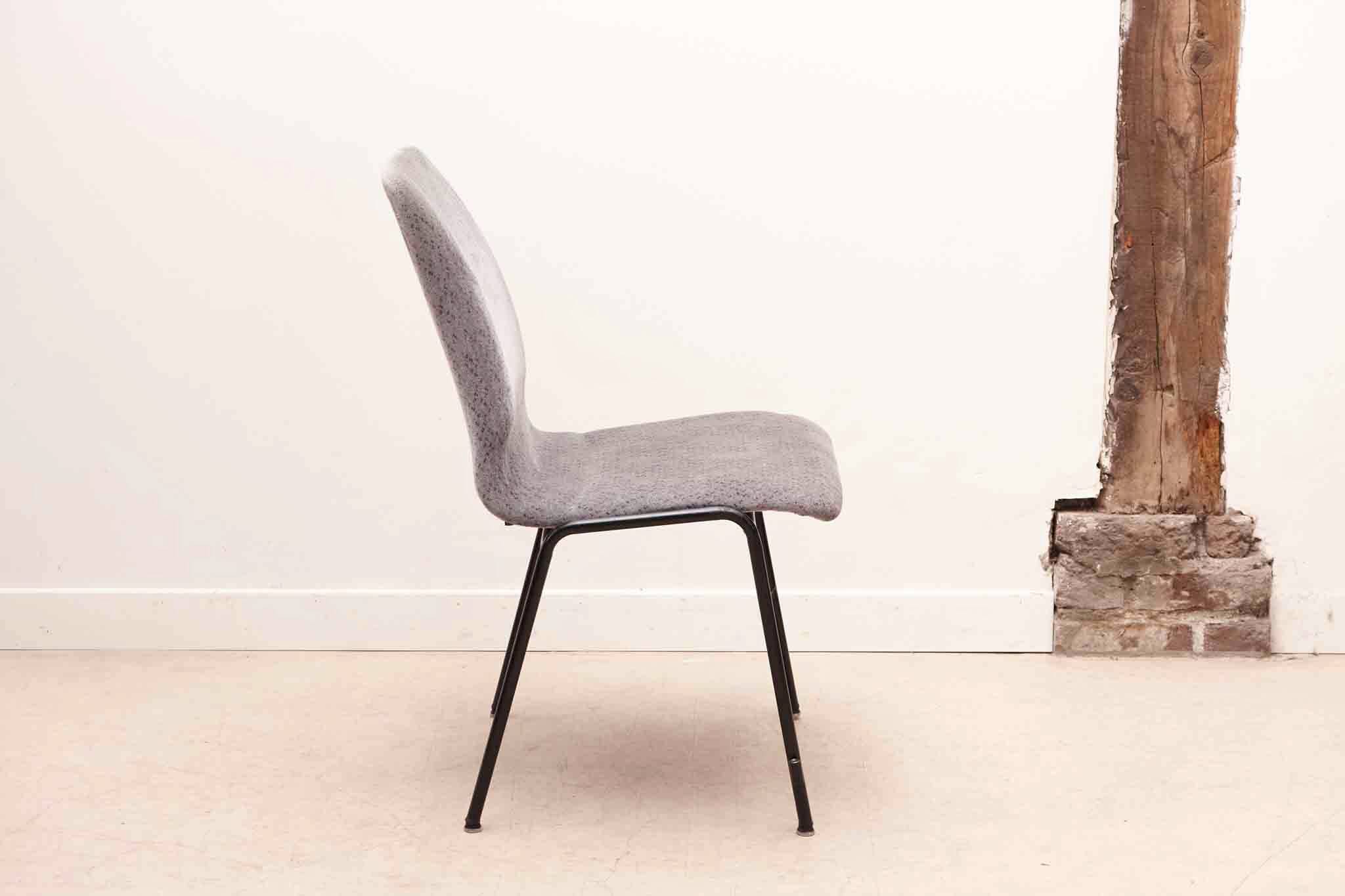 Grey fabric chair with pattern and black legs