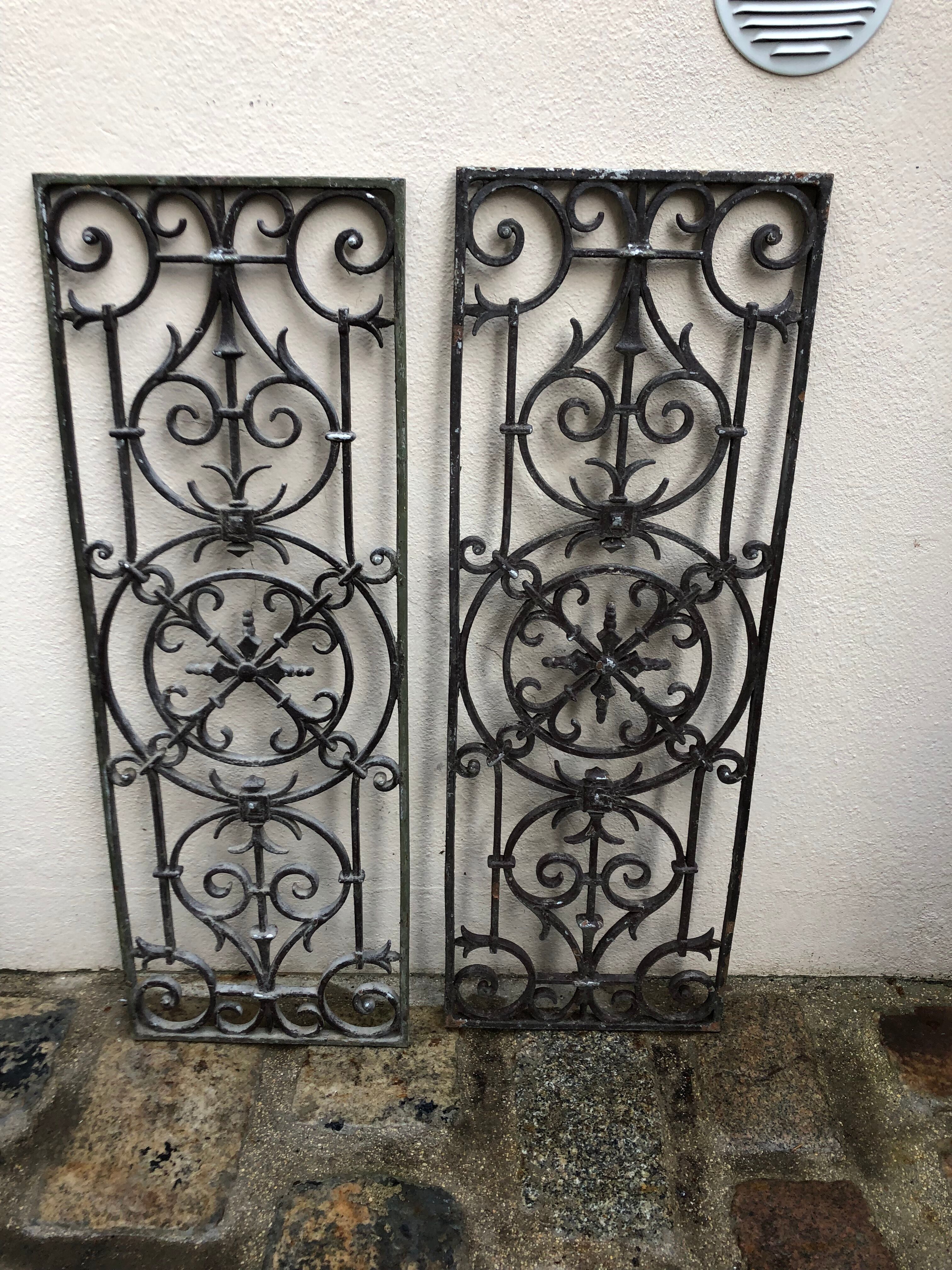 Pair of old cast iron door grilles