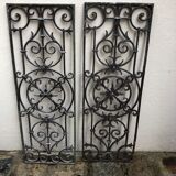 Pair of old cast iron door grilles