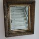 Antique mirror in wood and gilded stucco