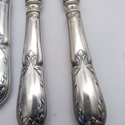 Set of 12 sfam knives in silver metal and stainless steel blades.