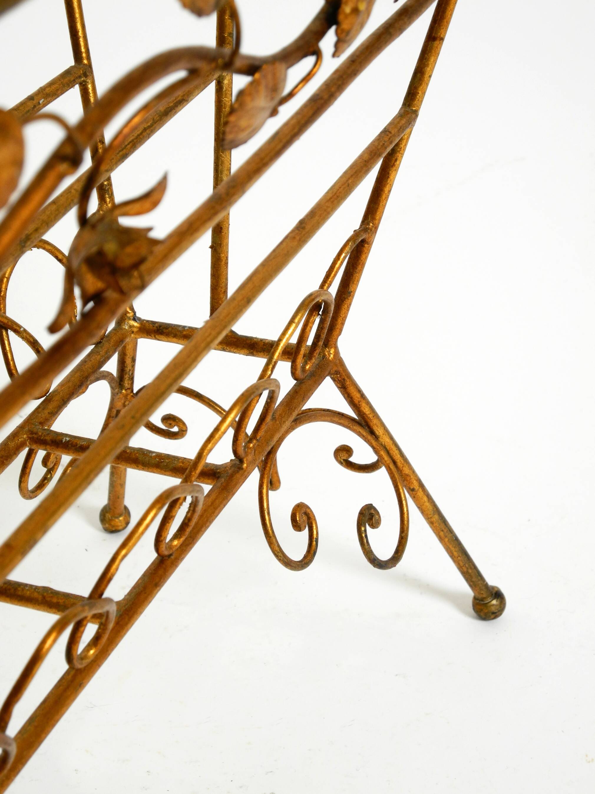 Extraordinary mid-century newspaper and magazine rack with a gilded metal