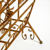 Extraordinary mid-century newspaper and magazine rack with a gilded metal