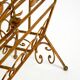Extraordinary mid-century newspaper and magazine rack with a gilded metal