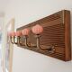 Wall-mounted coat rack with 5 hooks, powder pink ceramic and stained wood, 50 cm.