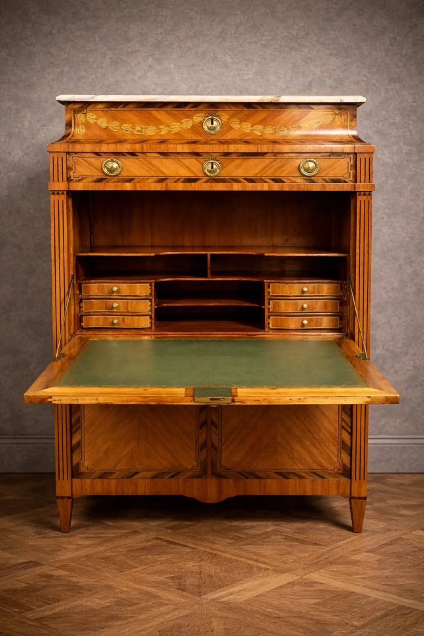 Secretary from the Louis XVI era in precious wood marquetry.