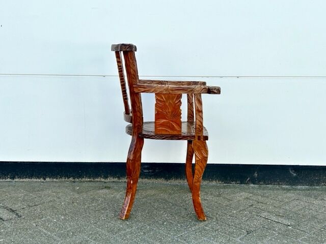 Hand stabbed teak armchair