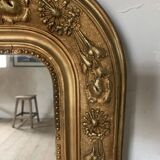 Golden fireplace mirror with pediment