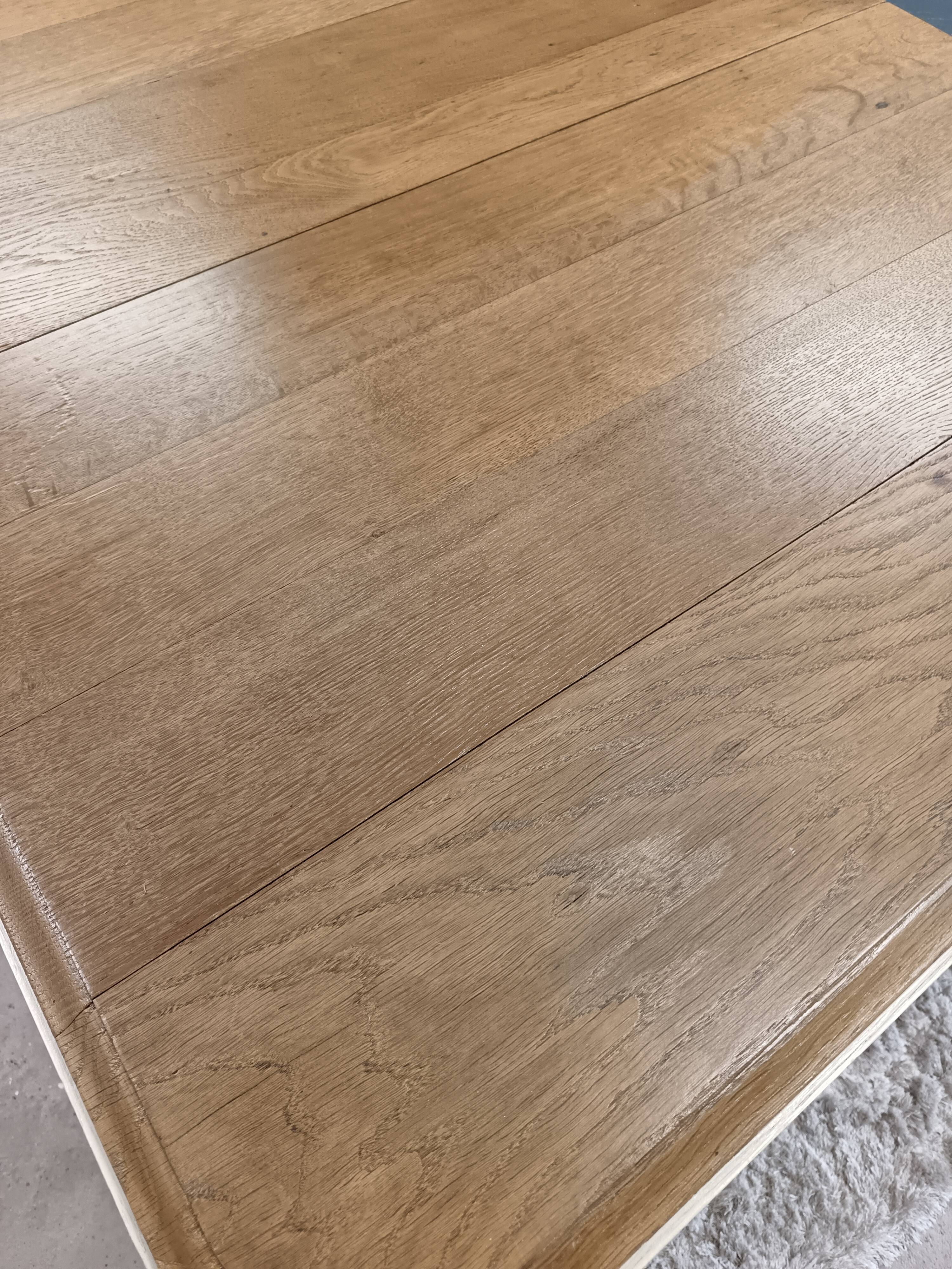 Restored oak table in natural wood and linen.