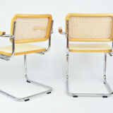 A pair of chairs with armrests, 1970s